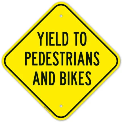 Yield To Pedestrians And Bikes Sign